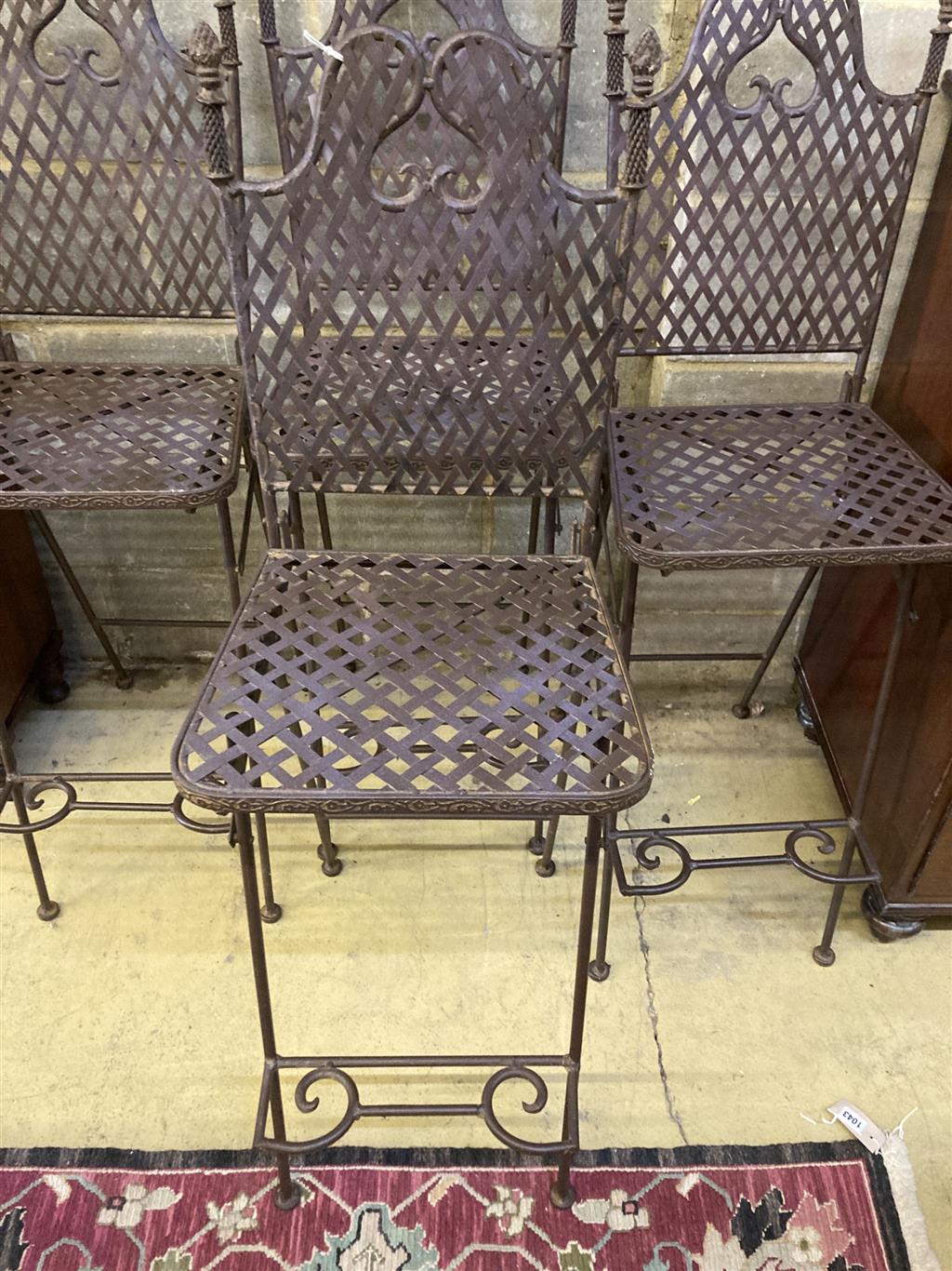 A set of four metal folding garden bar chairs, width 39cm, depth 38cm, height 120cm